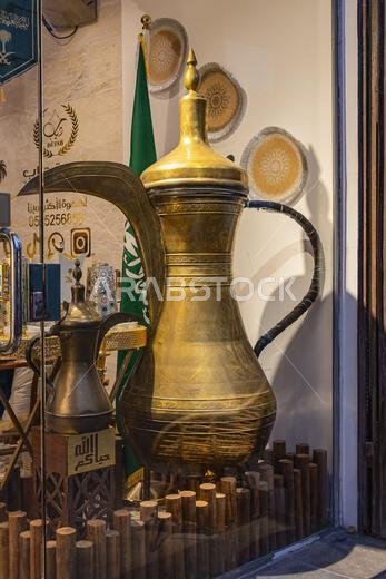 Middle East, Saudi Arabia, Mecca Province, Jeddah. November 21, 2023. Antique brass coffee pot in the Al-Balad historical district.