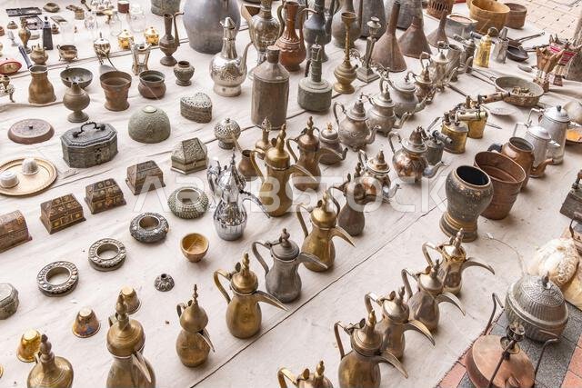 Middle East, Saudi Arabia, Riyadh, Al-Dirah. Traditional brass and brass coffee and tea pots at the Souq Al-Zal.
