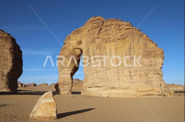 Geologist at Elephant Rock in the Arabian desert