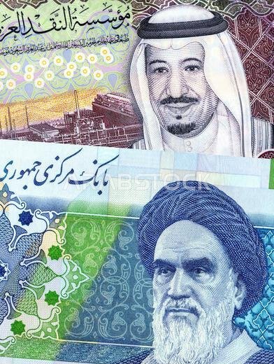 Saudi Arabia Riyal banknote with King Salman and Iranian rial banknote with Ayatollah Khomeini. Business concept of the exchange rate, stock exchange,