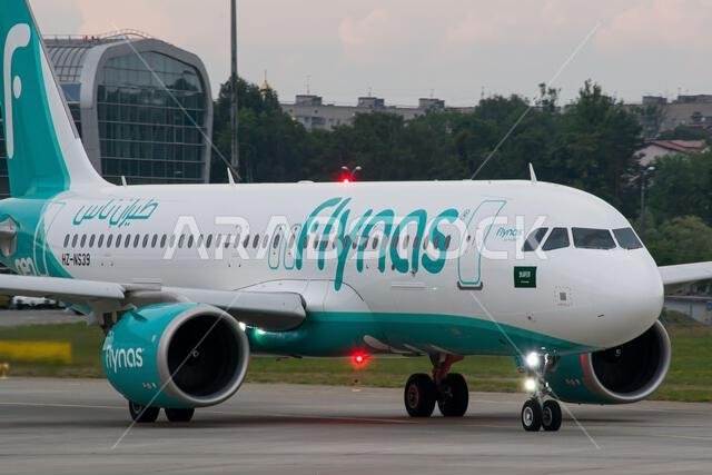Close-up of Saudi low-cost airline's Flynas Airbus A320 NEO taxiing for takeoff from Lviv