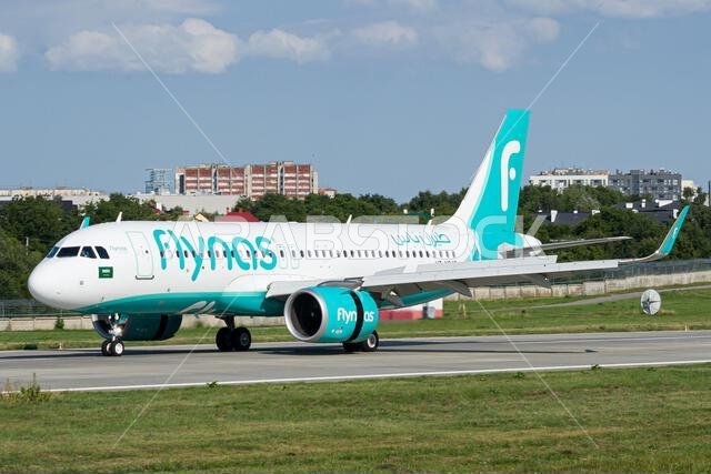 Saudi airline's Flynas Airbus A320 NEO slowing down after landing at Lviv, with reverse thrust on