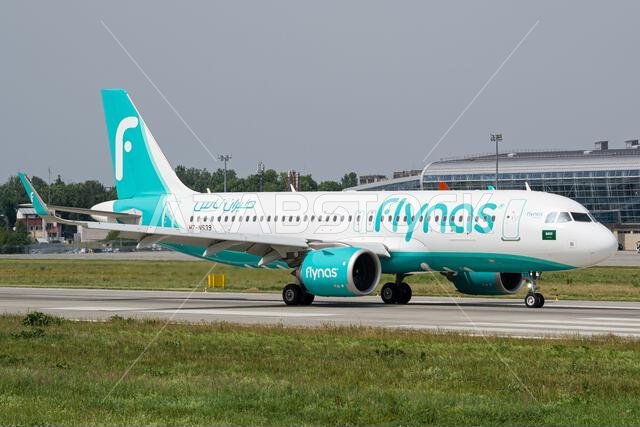Saudi low-cost airline's Flynas Airbus A320 taxiing to the gates after landing at Lviv Airport after a flight from Riyadh