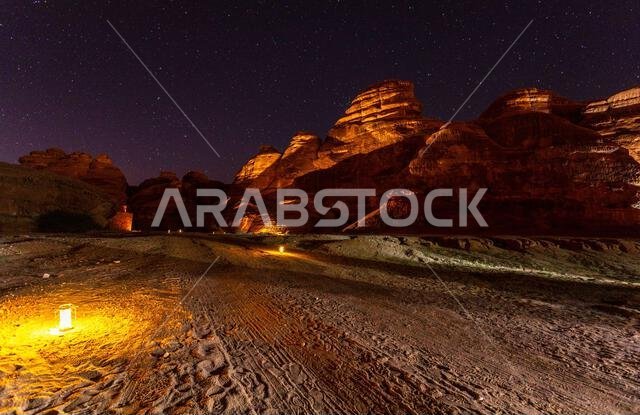 Starlight sky over illuminated desert, night panorama, Hegra, Al Ula, Saudi Arabia Starlight sky over illuminated desert, night panorama, Hegra, Al Ula, Saudi Arabia
