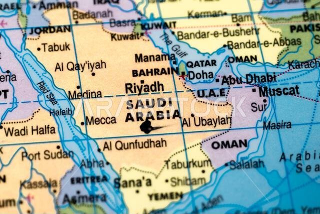This stock image shows the country of Saudi Arabia highlighted in black marker on a world map