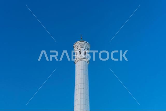 Muslim mosque with white trim and blue dome