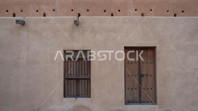 doha, qatar-November 01,2023 : old doors and windows at the historic zubarah fort. doha, qatar-November 01,2023 : old doors and windows at the historic zubarah fort.