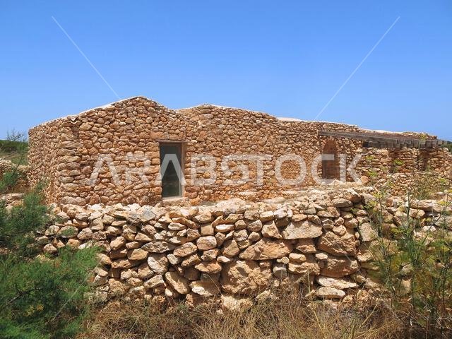 house built with dry stone walls typical of the warm Mediterranean areas house built with dry stone walls typical of the warm Mediterranean areas