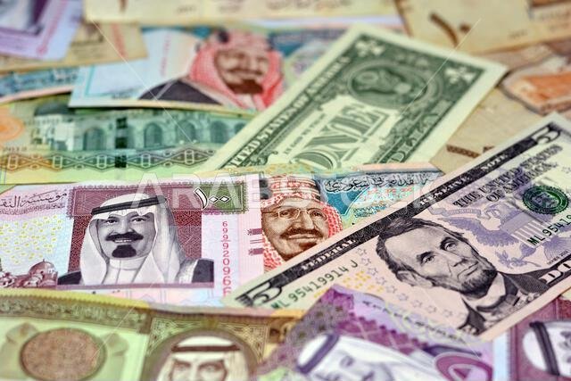 Background of Saudi Arabia riyals money banknotes bill and United States Of America dollars notes, American and Saudi money exchange rate, economy sta