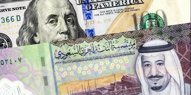 Saudi Arabia banknote with King Salman and American dollars banknote with Benjamin Franklin. Business concept of the exchange rate, stock exchange, tr