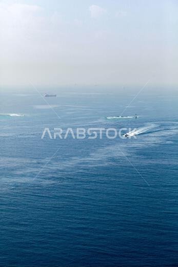 Aerial sea view with ships sailing the channel to the Jeddah Islamic Seaport, Saudi Arabia
