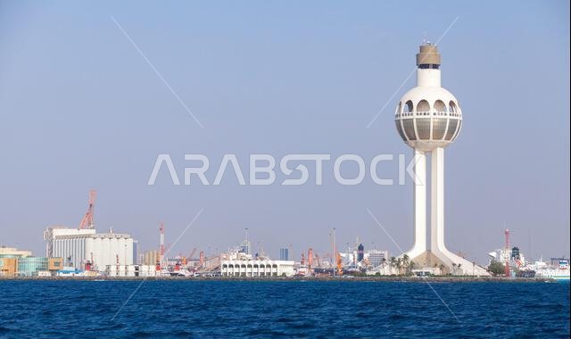 Jeddah Islamic Seaport seaside view with white traffic control tower. Saudi Arabia