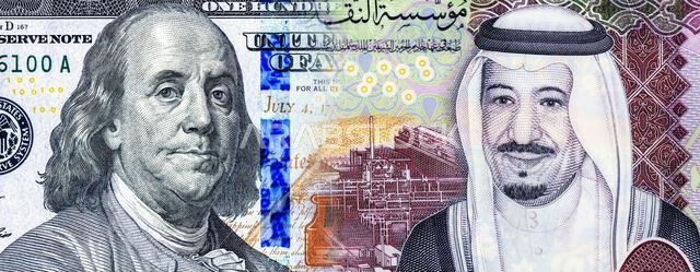 American dollars with Benjamin Franklin and Saudi Arabia banknote with King Salman  Business concept of the exchange rate, stock exchange
