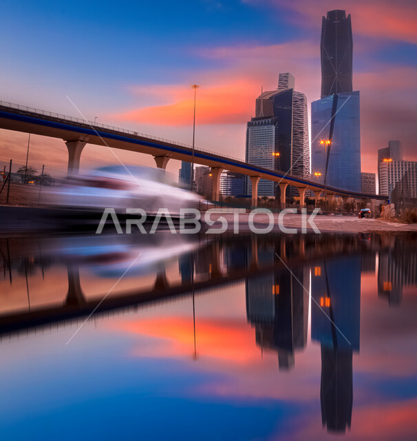 صورة ابداعية لمركز الملك عبدالله المالي ( كافد ) في الرياض بالمملكة العربية السعودية وقت الغروب، الأبراج وناطحات السحاب، معالم الرياض المشهورة، الطرق والشوارع، الفن الهندسي المعماري بالسعودية، السياحة في السعودية