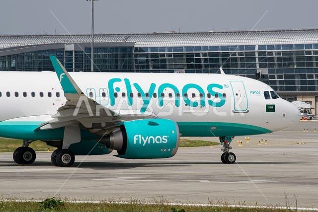 Close-up photo of Saudi airline's Flynas Airbus A320 NEO taxiing after landing at Lviv Airport