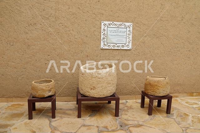 Old stone basins used for storing water on display at Masmak Fort Museum in Riyadh