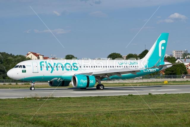 Saudi airline's Flynas Airbus A320 NEO slowing down after landing at Lviv, with reverse thrust on