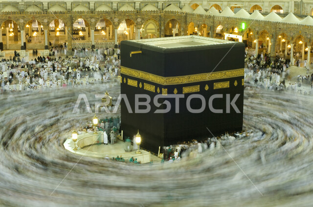An aesthetic image of the Kaaba in Mecca, pilgrims of the House of God performing Hajj and Umrah, circumambulation around the Kaaba, worship and getting closer to God, Hajj season 2022, Islam and worship