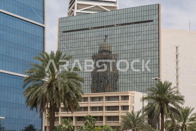 Reflection of the Boudl Tower / Narcissus Hotel in the glass facade of the King Faisal Foundation. King Fahd Rd, Al Olaya, Riyadh, Saudi Arabia