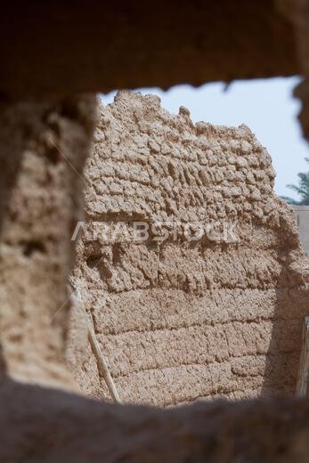 Ruins of ancient arab middle eastern old town built of mud bricks, old mosque with minaret in riyadh, saudi arabia