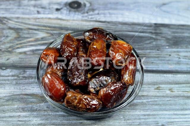 Ajwa dates, a cultivar of the palm date that is widely grown in Medina, Saudi Arabia., an oval-shaped, medium-sized date, often consumed Iftar for Ram