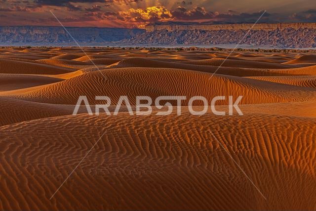 Sunset over sand dunes in desert landscape, Saudi Arabia