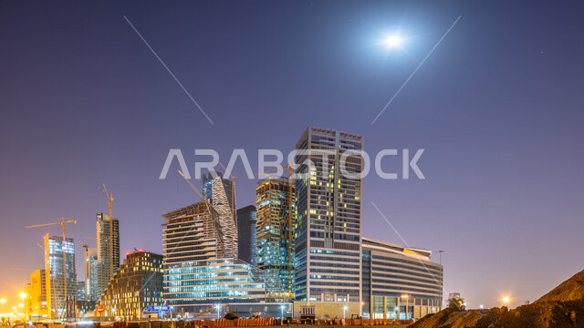 صورة ابداعية لمركز الملك عبدالله المالي ( كافد ) في الرياض بالمملكة العربية السعودية ليلا، معالم الرياض المشهورة، ابراج وناطحات سحاب مضيئة، الفن الهندسي المعماري بالسعودية، السياحة في السعودية