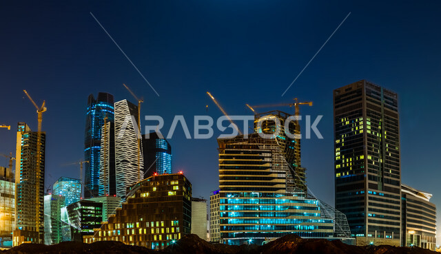 صورة ابداعية لمركز الملك عبدالله المالي ( كافد ) في الرياض بالمملكة العربية السعودية ليلا، معالم الرياض المشهورة، ابراج وناطحات سحاب مضيئة، الفن الهندسي المعماري بالسعودية، السياحة في السعودية