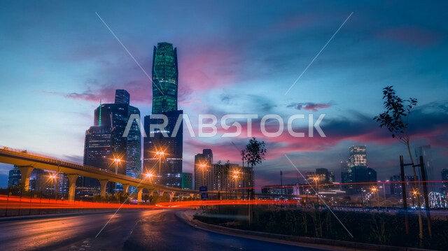 صورة ابداعية لمركز الملك عبدالله المالي ( كافد ) في الرياض بالمملكة العربية السعودية ليلا، الأبراج وناطحات السحاب، معالم الرياض المشهورة، الطرق والشوارع، الفن الهندسي المعماري بالسعودية، السياحة في السعودية