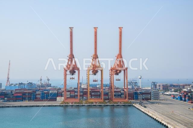 Jeddah, Saudi Arabia - December 21, 2022: Port cranes for loading containers. View of the cargo port in Jeddah.