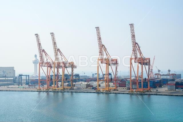 Jeddah, Saudi Arabia - December 21, 2022: Port cranes for loading containers. View of the cargo port in Jeddah.