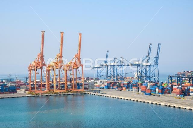 Jeddah, Saudi Arabia - December 21, 2022: Port cranes for loading containers. View of the cargo port in Jeddah.