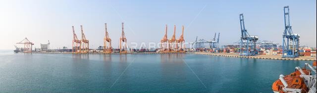 Jeddah, Saudi Arabia - December 21, 2022: Panorama of the cargo port in Jeddah on a sunny day. High resolution.