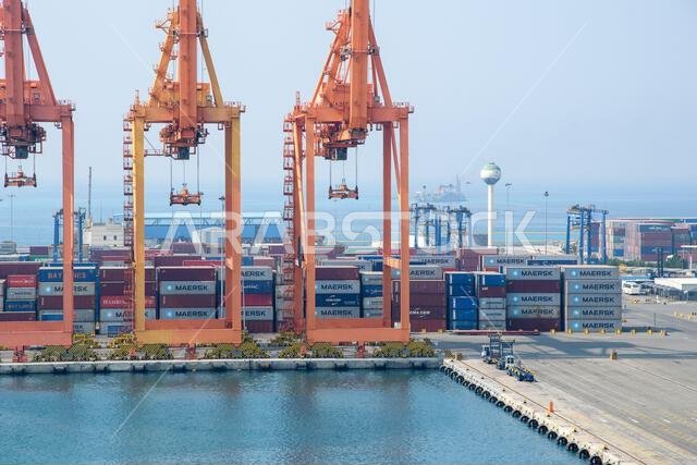 Jeddah, Saudi Arabia - December 21, 2022: Port cranes for loading containers. View of the cargo port in Jeddah.