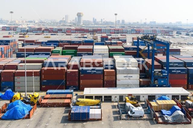 Jeddah, Saudi Arabia - December 21, 2022: Containers ready for loading. View of the cargo port in Jeddah. Jeddah, Saudi Arabia - December 21, 2022: Containers ready for loading. View of the cargo port in Jeddah.