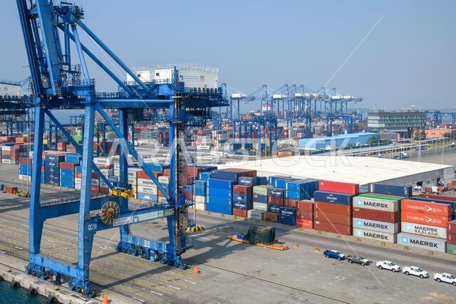 Jeddah, Saudi Arabia - December 21, 2022: Port cranes for loading containers. View of the cargo port in Jeddah.