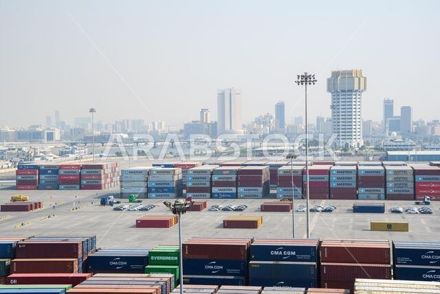 Jeddah, Saudi Arabia - December 21, 2022: Containers ready for loading. View of the cargo port in Jeddah. Jeddah, Saudi Arabia - December 21, 2022: Containers ready for loading. View of the cargo port in Jeddah.