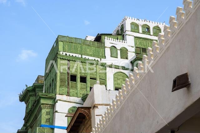 Jeddah, Saudi Arabia - December 21, 2022: Street life in the Old City. The unique architecture of the medieval Arab city. Historic Jeddah.