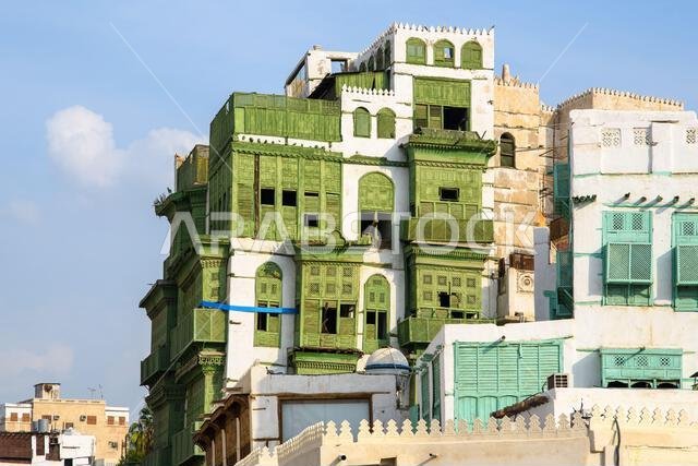 Jeddah, Saudi Arabia - December 21, 2022: Street life in the Old City. The unique architecture of the medieval Arab city. Historic Jeddah.