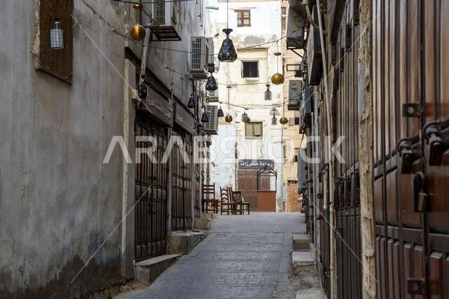 Jeddah, Saudi Arabia - December 21, 2022: Street life in the Old City. The unique architecture of the medieval Arab city. Historic Jeddah. Jeddah, Saudi Arabia - December 21, 2022: Street life in the Old City. The unique architecture of the medieval Arab city. Historic Jeddah.