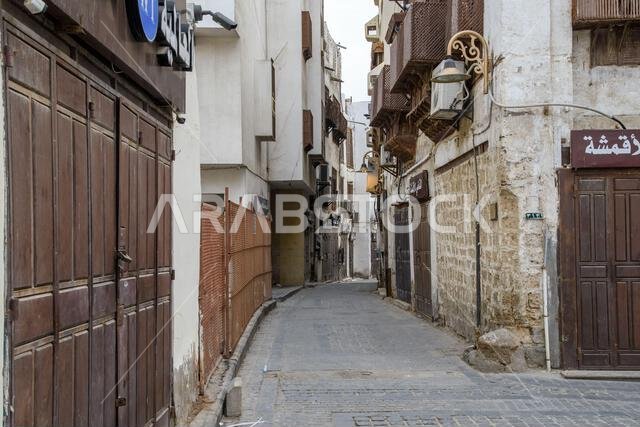 Jeddah, Saudi Arabia - December 21, 2022: Street life in the Old City. The unique architecture of the medieval Arab city. Historic Jeddah.
