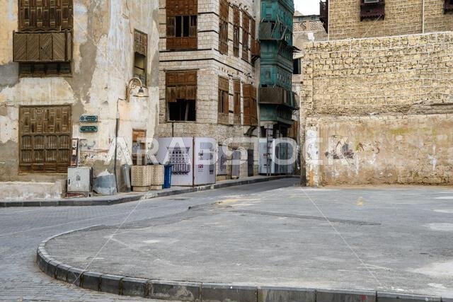 Jeddah, Saudi Arabia - December 21, 2022: Street life in the Old City. The unique architecture of the medieval Arab city. Historic Jeddah. Jeddah, Saudi Arabia - December 21, 2022: Street life in the Old City. The unique architecture of the medieval Arab city. Historic Jeddah.