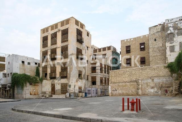 Jeddah, Saudi Arabia - December 21, 2022: Street life in the Old City. The unique architecture of the medieval Arab city. Historic Jeddah. Jeddah, Saudi Arabia - December 21, 2022: Street life in the Old City. The unique architecture of the medieval Arab city. Historic Jeddah.