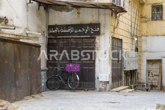 Jeddah, Saudi Arabia - December 21, 2022: Street life in the Old City. The unique architecture of the medieval Arab city. Historic Jeddah.