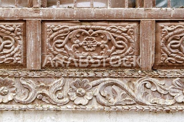 Jeddah, Saudi Arabia - December 21, 2022: Street life in the Old City. The unique architecture of the medieval Arab city. Historic Jeddah. Woodcarving