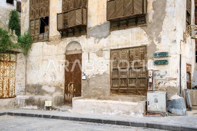 Jeddah, Saudi Arabia - December 21, 2022: Street life in the Old City. The unique architecture of the medieval Arab city. Historic Jeddah.