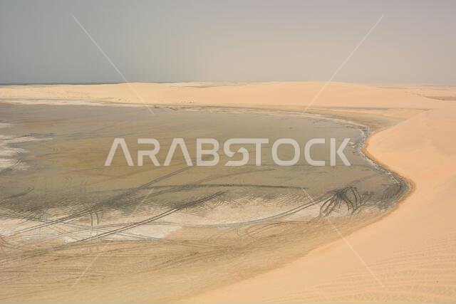 Sand dunes with low tide. Khawr al Udayd, the inland sea. Qatar