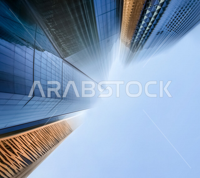 صورة ابداعية بزاوية سفلية لمركز الملك عبدالله المالي ( كافد ) في الرياض بالمملكة العربية السعودية، الأبراج وناطحات السحاب، معالم الرياض المشهورة، الفن الهندسي المعماري بالسعودية، السياحة في السعودية