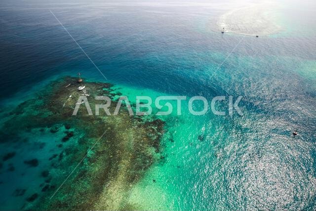 Persian Gulf aerial view, Saudi Arabia. Red beacon tower stands in shallow waters