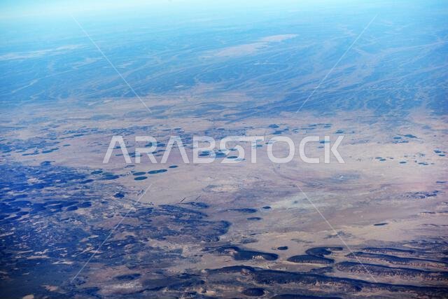 Aerial view of circular agriculture fields in the Arabian desert in Saudi Arabia.